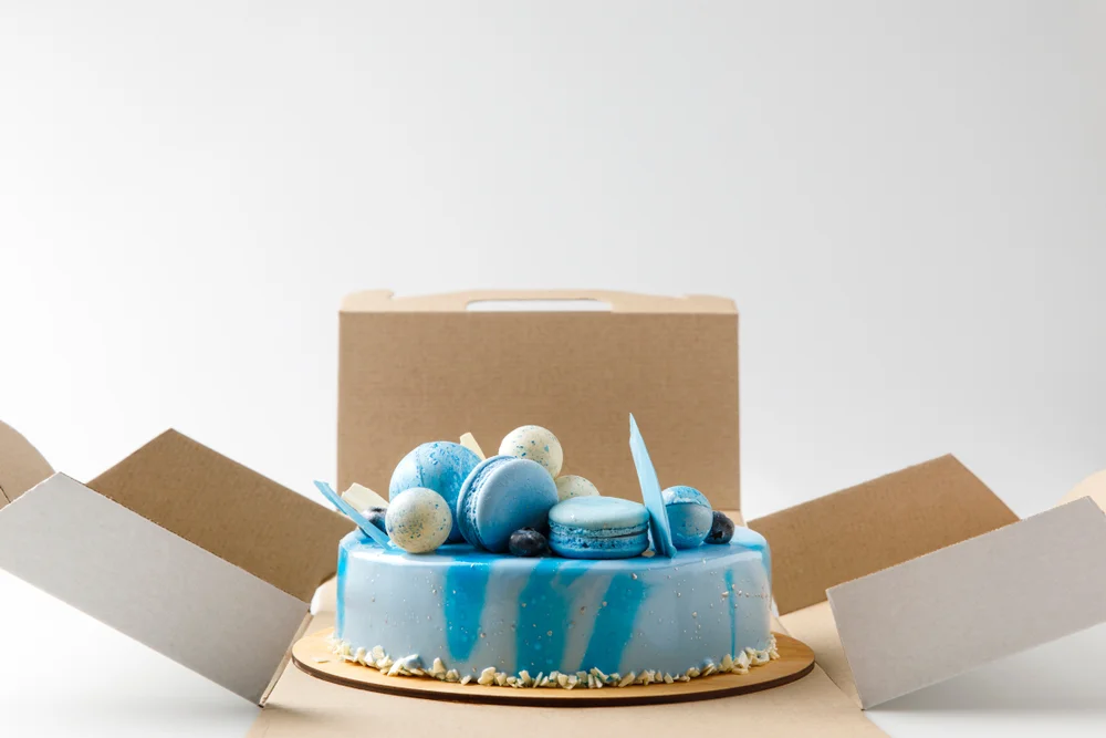 blue tasty cake in opened box