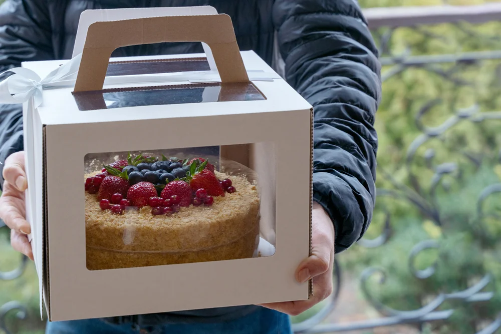 corrugated box with holiday cake